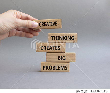 Creative Thinking symbol. Wooden blocks with words Creative Thinking Solves Big Problems. Businessman hand. Beautiful grey background. Businessman hand. Business and Creative Thinking concept. Copy Creative Thinking symbol. Wooden blocks with words Creative Thinking Solves Big Problems. Businessman hand. Beautiful grey background. Businessman hand. Business and Creative Thinking concept. Copy 141369019