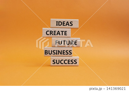 Business success symbol. Wooden blocks with words Ideas create future business success. Beautiful orange background. Business and Business success concept. Copy space 141369021