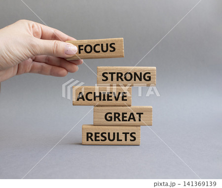 Great Results symbol. Wooden blocks with words Focus strong achieve great results. Businessman hand. Beautiful grey background. Business and Great Results concept. Copy space Great Results symbol. Wooden blocks with words Focus strong achieve great results. Businessman hand. Beautiful grey background. Business and Great Results concept. Copy space 141369139
