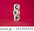CRP - C-Reactive Protein Test symbol. Wooden cubes with word CRP. Beautiful red background. Medical and C-Reactive Protein Test concept. Copy space. 141369392