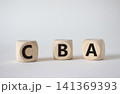 CBA - Cost Benefit Analysis symbol. Wooden cubes with word CBA. Beautiful white background. Business and Cost Benefit Analysis concept. Copy space. 141369393