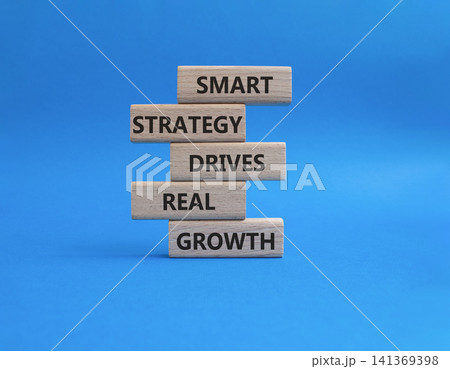 Growth symbol. Wooden blocks with words Smart strategy drives real growth. Beautiful blue background. Business and Growth concept. Copy space Growth symbol. Wooden blocks with words Smart strategy drives real growth. Beautiful blue background. Business and Growth concept. Copy space 141369398