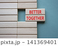 BETTER TOGETHER symbol. Concept word BETTER TOGETHER on wooden blocks. Beautiful grey green background. Business and BETTER TOGETHER concept. Copy space 141369401