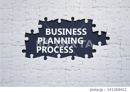 Business Planning Process symbol. White puzzle with words Business Planning Process. Beautiful deep blue background. Business concept. Copy space. Business Planning Process symbol. White puzzle with words Business Planning Process. Beautiful deep blue background. Business concept. Copy space. 141369421