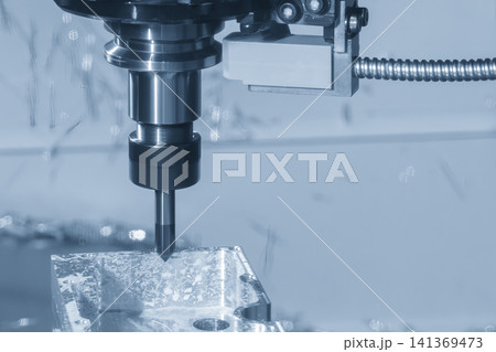 High-precision CNC milling machine performing a chamfering cut process on an aluminum case part. High-precision CNC milling machine performing a chamfering cut process on an aluminum case part. 141369473