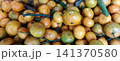 A dense stack of local mandarin oranges. 141370580