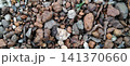 A mixture of gravel and laterite, topped with a layer of soil. 141370660