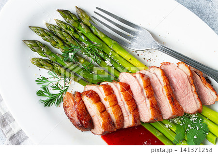 roast duck breast, with asparagus, with red sauce, on a white plate, homemade, no people, roast duck breast, with asparagus, with red sauce, on a white plate, homemade, no people, 141371258