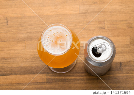 Tulip Beer Glass Beside Opened Can Tulip Beer Glass Beside Opened Can 141371694