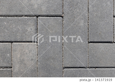 Detailed close-up top view of gray concrete pavers Detailed close-up top view of gray concrete pavers 141371919