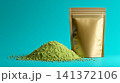 Gold zipper pouch mockup with green powder pile 141372106