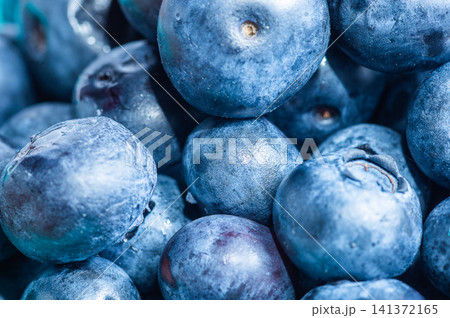 Extreme macro background texture of fresh wet blueberries piled up together in a heap 141372165