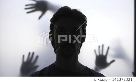 Silent Figure Confronts Unseen Hands Pressing Against Translucent Surface In Moody Setting. Media Silent Figure Confronts Unseen Hands Pressing Against Translucent Surface In Moody Setting. Media 141372321