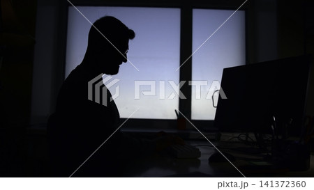 Senior Financial Analyst Scrutinizing Spreadsheet Charts During Late Evening Work Session In Quiet Office . Media 141372360