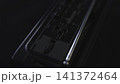Detailed Shot Of Person Adjusting Sound Controls On Studio Equipment Interface In Low Lighting Conditions. Media 141372464