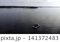Aquaculture Vessel Actively Managing Mussel Lines Amidst Tranquil Waters In Sheltered Bay Environment . Media 141372483