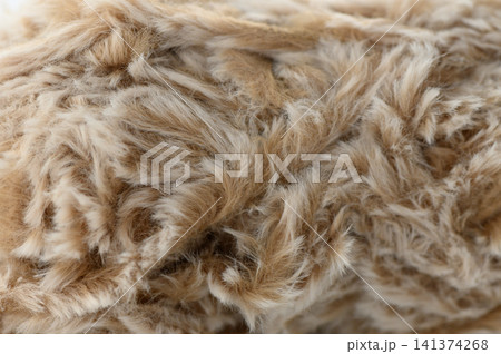 close-up view of beige and brown fur texture in a neutral setting with a clean background for fashion and textile design resources and editorial use cases in home decor. close-up view of beige and brown fur texture in a neutral setting with a clean background for fashion and textile design resources and editorial use cases in home decor. 141374268