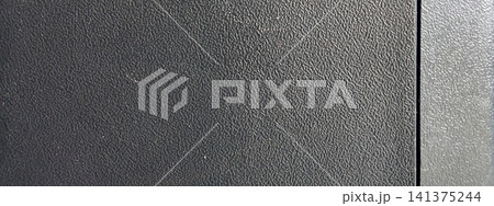 Dark gray textured plastic surface with a divider panel Dark gray textured plastic surface with a divider panel 141375244