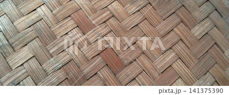 A herringbone-patterned bamboo weave texture with a natural look and a weathered feel. 141375390