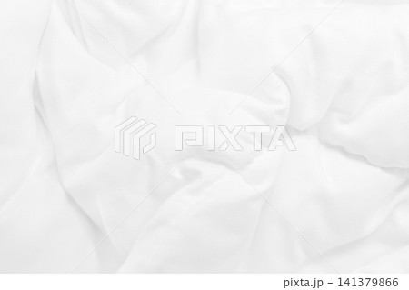 Close up top view of white bedding sheet and wrinkle messy blanket in bedroom after wake up in the morning. Close up top view of white bedding sheet and wrinkle messy blanket in bedroom after wake up in the morning. 141379866
