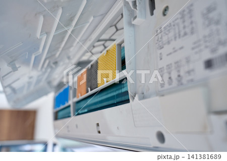 Dirty air conditioner filters inside open wall mounted unit Dirty air conditioner filters inside open wall mounted unit 141381689