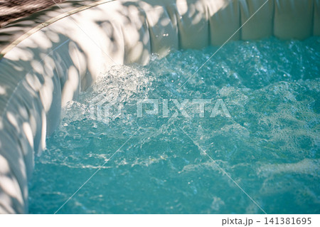 Bubbling Water Jets in Inflatable Hot Tub Close Up Bubbling Water Jets in Inflatable Hot Tub Close Up 141381695