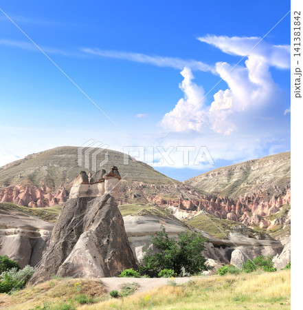 Beautiful landscape with Symbol of Cappadocia - Fairy Chimney or Multihead stone mushrooms in Pasabag Valley, Anatolia, Turkey. Topic of vacation, travel, trip abroad on vacation, cruises and tours Beautiful landscape with Symbol of Cappadocia - Fairy Chimney or Multihead stone mushrooms in Pasabag Valley, Anatolia, Turkey. Topic of vacation, travel, trip abroad on vacation, cruises and tours 141381842