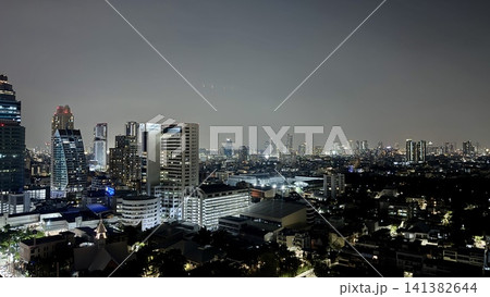 Wide metropolitan skyline stretching across the night horizon Wide metropolitan skyline stretching across the night horizon 141382644