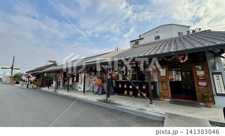 Traditional shopping street lined with historic wooden storefronts 141383046