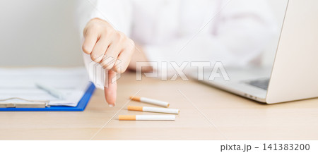 doctor hand show thumb down to refuse and breaking cigarette, quitting smoking for healthy lungs, prevent Lung Cancer and Emphysema, World No Tobacco Day concept doctor hand show thumb down to refuse and breaking cigarette, quitting smoking for healthy lungs, prevent Lung Cancer and Emphysema, World No Tobacco Day concept 141383200