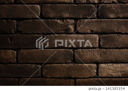 Dark brown textured brick wall surface pattern 141385354