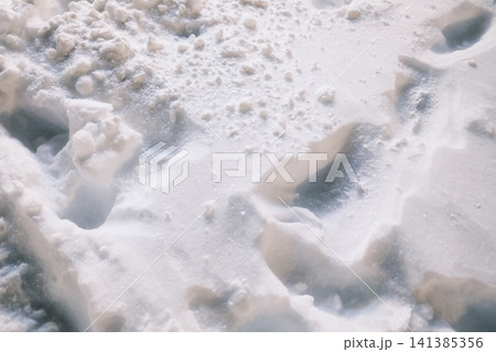 Fresh snow with deep tracks on a winter day Fresh snow with deep tracks on a winter day 141385356