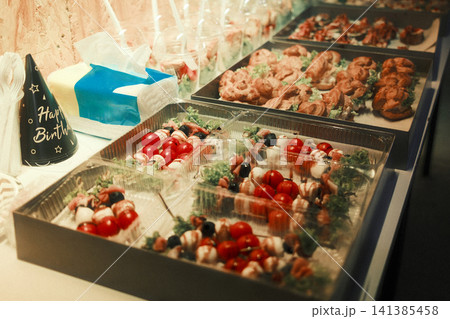 Catering Buffet with Caprese Skewers and Savory Pastries at Event Catering Buffet with Caprese Skewers and Savory Pastries at Event 141385458