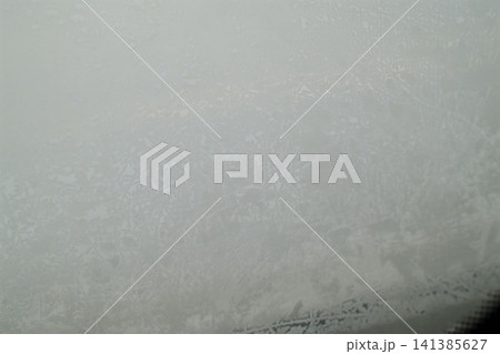 Ice crystals form on a frozen car window Ice crystals form on a frozen car window 141385627