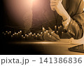 Business man on digital stock market financial indicator background. Digital business and stock market financial indicator on LED. Double exposure of business man and digital stock market financial. 141386836