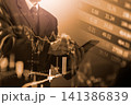 Business man on digital stock market financial indicator background. Digital business and stock market financial indicator on LED. Double exposure of business man and digital stock market financial. 141386839