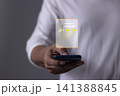 Customer Satisfaction, Young Man hand holding Smart Phone with five star to review and give 5 stars  141388845