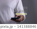 Customer Review, Young Man hand holding Smart Phone with five star to review and give 5 stars  141388846