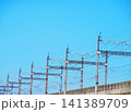 新幹線に電力を供給する架線柱と青空の風景 新幹線に電力を供給する架線柱と青空の風景 141389709