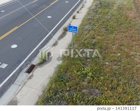Blue sign marking the start of an electric vehicle charging lane. Blue sign marking the start of an electric vehicle charging lane. 141391117
