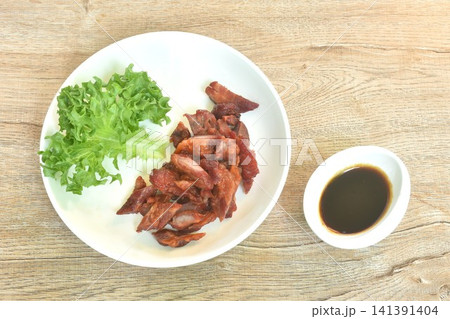 grilled salty and sweet pork belly honey with Filley vegetable salad on plate dipping spicy chili sauce grilled salty and sweet pork belly honey with Filley vegetable salad on plate dipping spicy chili sauce 141391404