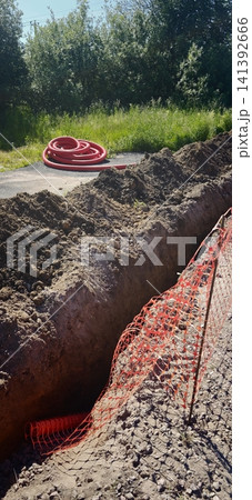 Underground electrical cable installation in progress on a sunny day 141392666