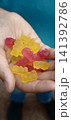 Marmalade bears held in a hand, bright colors and sweet shapes 141392786