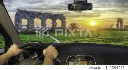 Driving past the ancient Roman Aqueduct Park in Italy Driving past the ancient Roman Aqueduct Park in Italy 141394025