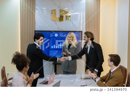 Diverse colleagues gather in brainstorm discuss statistics together. 141394970