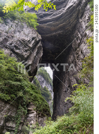 The Majestic Natural Bridges of Wulong Karst, Colossal Limestone Archway in Wulong, Chongqing, Dramatic Karst Gorge and Natural Bridge. 141395160
