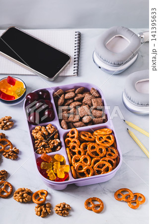 Reusable snackle lunch box for students on their desk vertical view 141395633