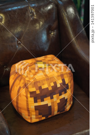 top view colorful square cube-shaped cushion placed on a brown leather sofa, object, decor, fashion, copy space top view colorful square cube-shaped cushion placed on a brown leather sofa, object, decor, fashion, copy space 141397001
