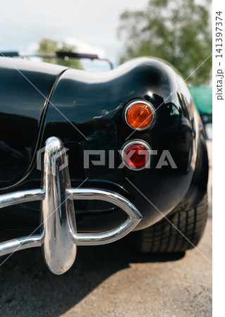 Rear Lights and Chrome Bumper of Classic AC Cobra Style Roadster Rear Lights and Chrome Bumper of Classic AC Cobra Style Roadster 141397374
