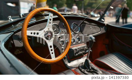 Classic AC Cobra Style Roadster Interior With Wooden Steering Wheel 141397380